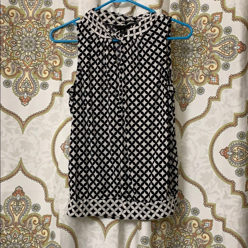 Sleeveless black and white work or dress shirt,